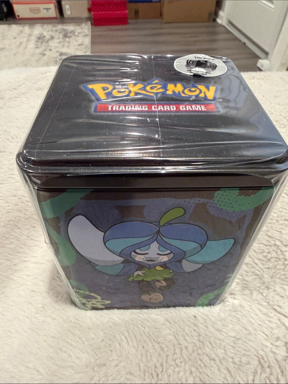 Pokemon Black Tin with Blue-Green Grookey-Adjacent Artwork
